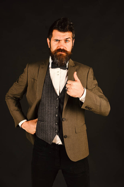 Businessman with serious face shows thumbs up. Office manager - Fotografie, Obrázek