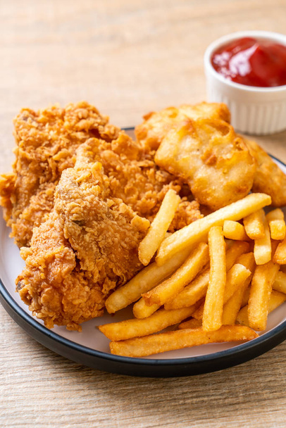 fried chicken with french fries and nuggets meal - junk food and unhealthy food - Φωτογραφία, εικόνα