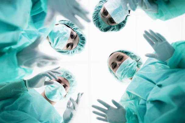 Surgeons standing above of the patient before surgery - Photo, Image