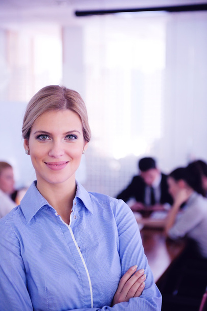 business woman with her staff in background at office - Фото, изображение