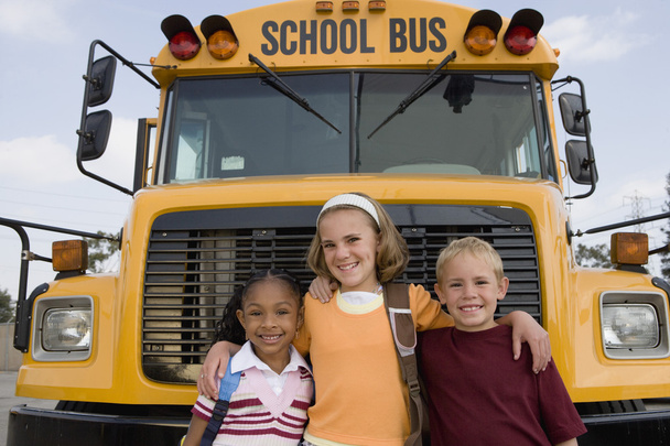 Students Standing In Front Of School Bus - Valokuva, kuva