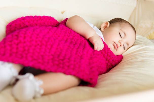 Sleeping baby covered with knitted blanket - Photo, Image