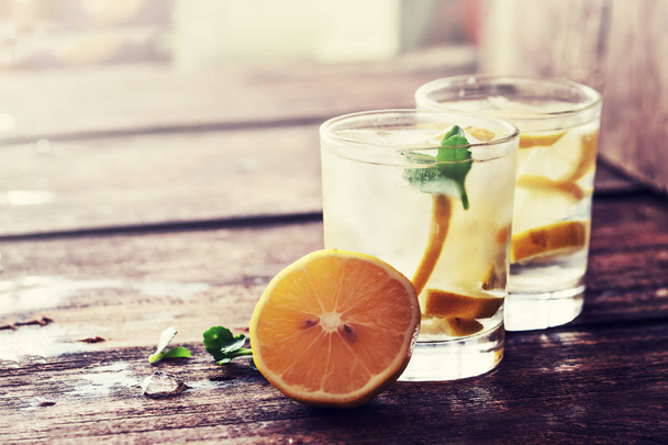 fresh homemade lemonade in glasses on wooden table - Foto, Imagem