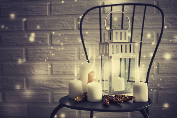 closeup view of candles and christmas decorations in vintage style on chair - Photo, Image