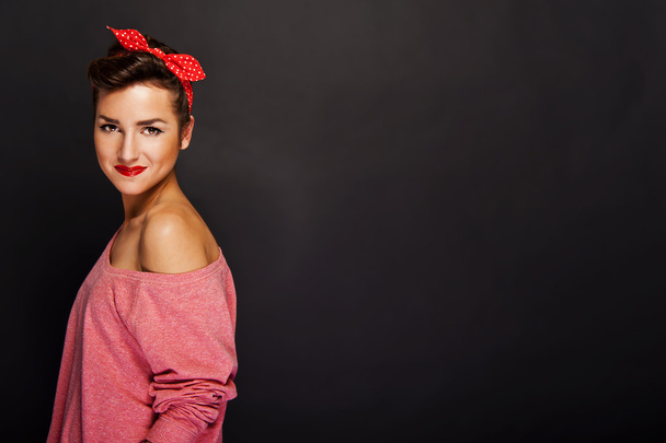 Pin-up woman with big smile on black background - Foto, afbeelding