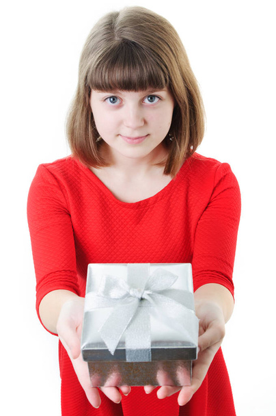 An image of young girl with gift box on white - Photo, image