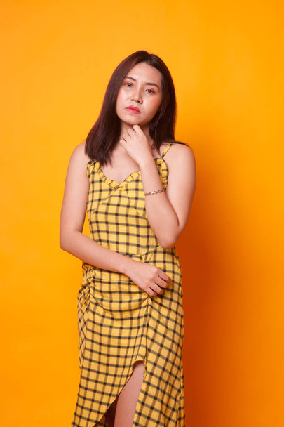 Portrait of beautiful young Asian woman on yellow background - Φωτογραφία, εικόνα