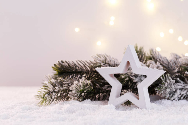 Wooden star fir branch lightd and snow Christmas card template copy space - Foto, Imagen