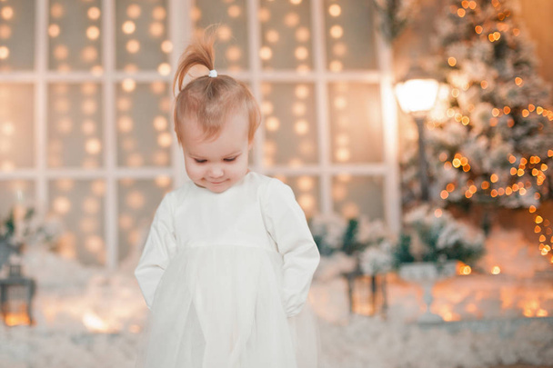 beautiful baby on christmas decorated room - Foto, immagini