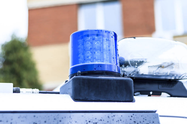 carro da polícia em seus flashers azul. close-up
. - Foto, Imagem