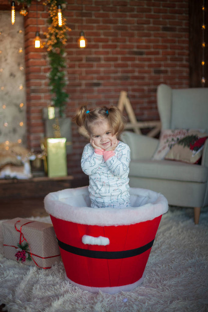 beautiful baby on christmas decorated room - Photo, Image