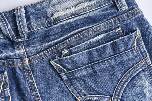 Back side of denim jeans texture detail with pocket, Close up. Blue jeans texture. - Fotó, kép