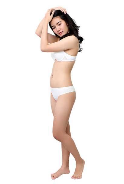 beautiful young asian woman in white bikini and white background - Zdjęcie, obraz