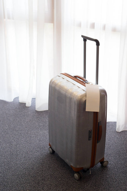 Suitcase or luggage bag in a modern hotel room - 写真・画像