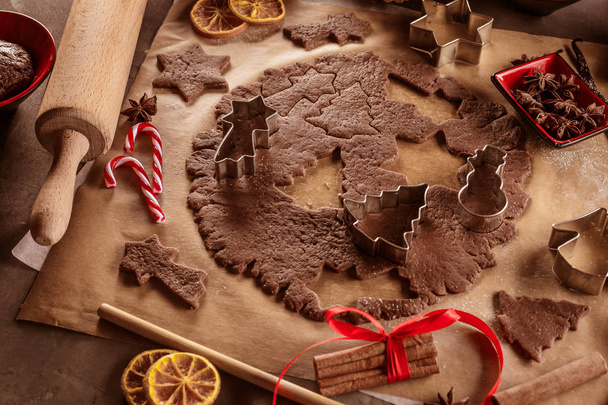 Christmas baking ingredients and tolls for dough preparation. Flour, eggs, rolling pin and cookie cutters - 写真・画像
