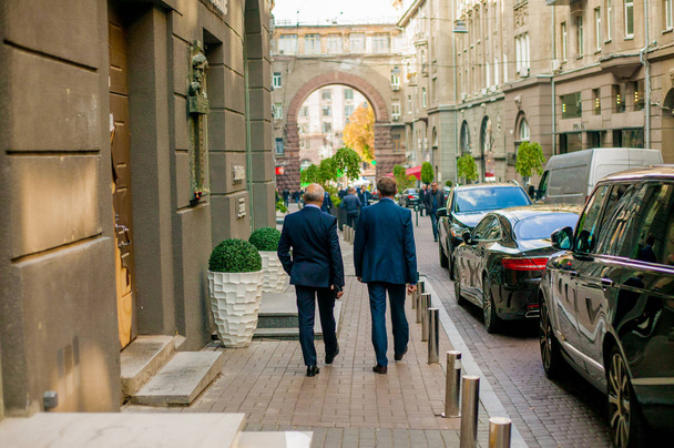 successful businessman in a suit stands back in the city - Fotó, kép