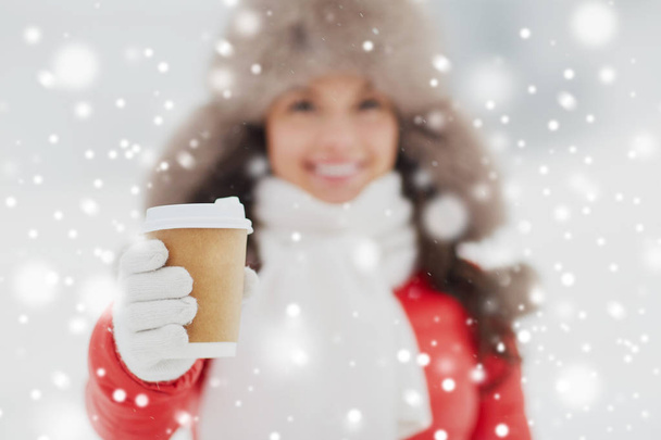 happy woman with coffee cup in winter - Photo, Image