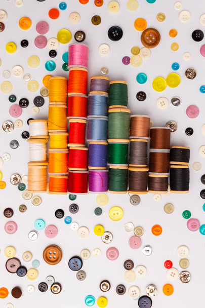 Spool of sewing threads and buttons different colors and types - Foto, Bild