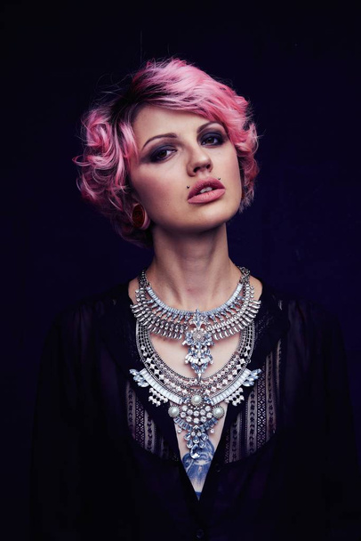 Beautiful Portrait of woman with pink hair  and necklace - Фото, изображение