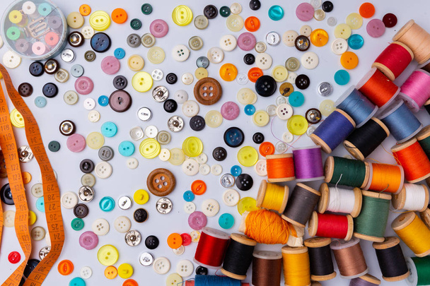 Spool of sewing threads and buttons different colors and types - Foto, Bild