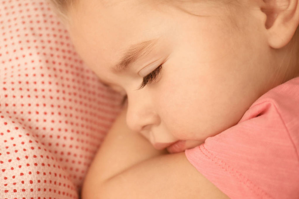Cute little girl sleeping in bed at home, closeup - 写真・画像
