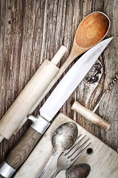 closeup view of vintage kitchen utensils over wooden table - 写真・画像