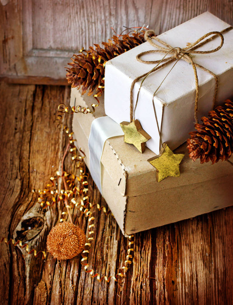 closeup view of wrapped christmas gifts with holiday decorations - Photo, Image