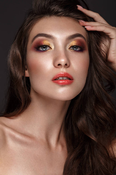 Beautiful girl with creative colorful make up. Beauty face. - Foto, immagini