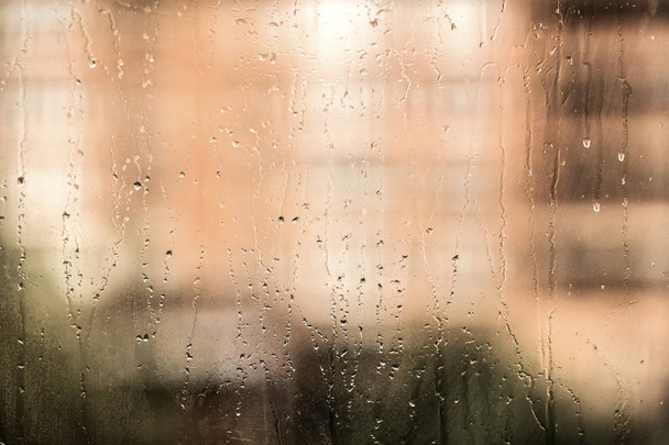 rain texture background with water drops on glass green color - Photo, Image