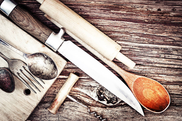 closeup view of vintage kitchen utensils over wooden table - Foto, Imagem