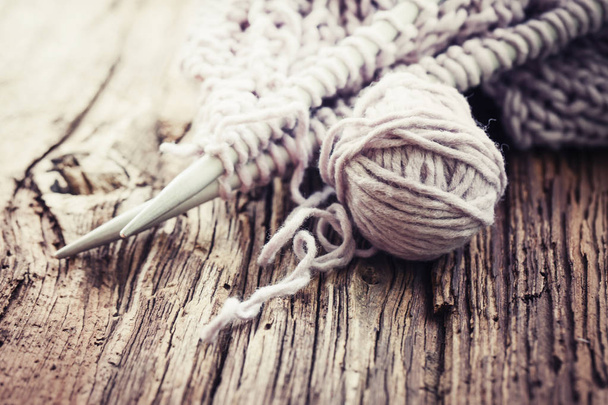 closeup view of knitting needles and yarn over wooden table - Valokuva, kuva