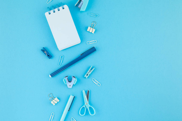Top view knolling flat lay of workspace desk styled design school and office supplies with copy space turquoise blue color paper background minimal style. Template for feminine blog social media - Fotoğraf, Görsel