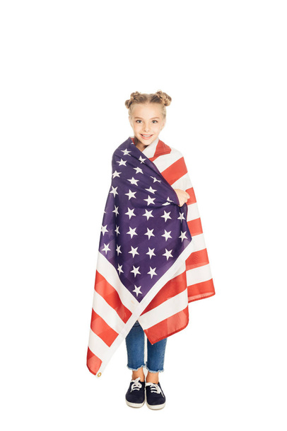 happy child holding american flag and smiling at camera isolated on white - Foto, immagini