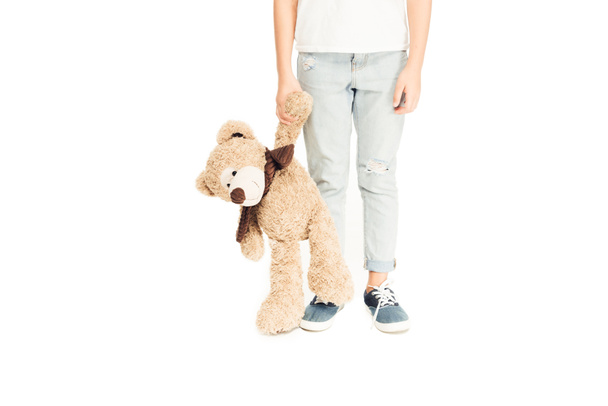 cropped image of child holding teddy bear isolated on white - Foto, immagini