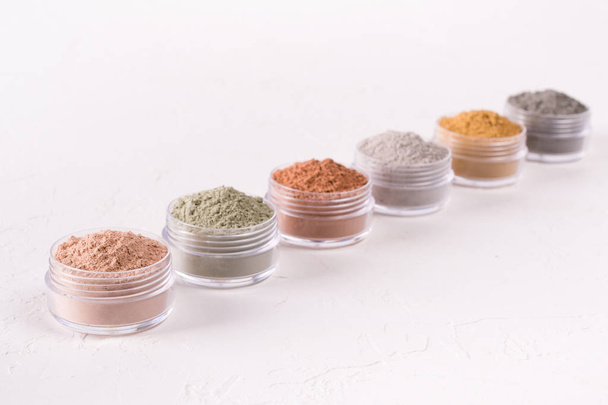 Set of different cosmetic clay mud powders on white background - Fotoğraf, Görsel