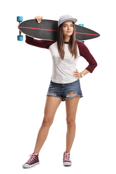 Full length portrait of a skater girl with a longboard isolated on white background - Φωτογραφία, εικόνα