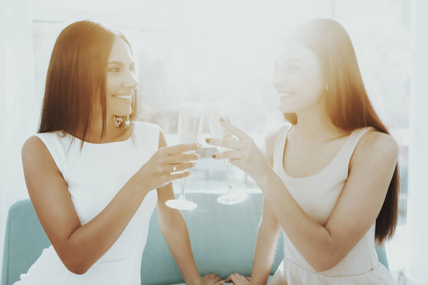 Girls Are Drinking Champagne Before Hen-Party. Pre-wedding Concept. Beautiful Shiny Smile. Resting With Bride. Sunny Day. Good Mood. Young And Attractive. Happy Holiday. Long Hair. - Photo, Image