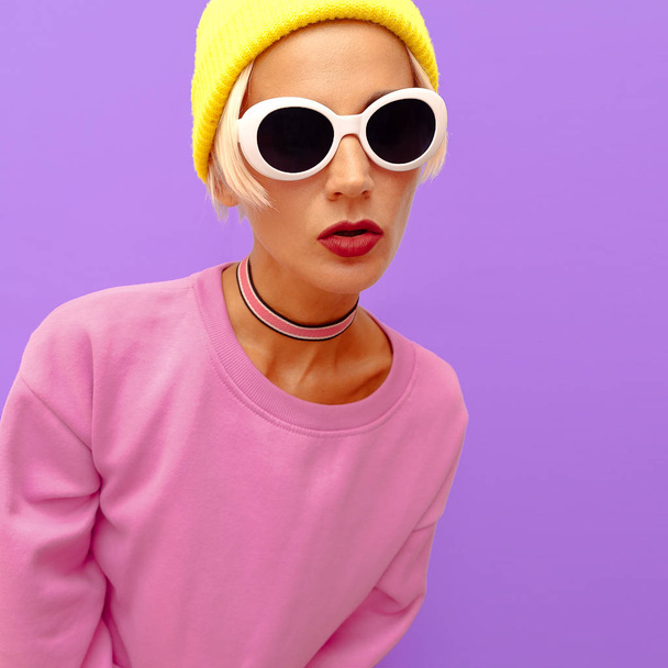 Stylish girl in fashion accessories. Beanie Cap, Sunglasses and choker. Vanilla fashion vibes - Photo, Image