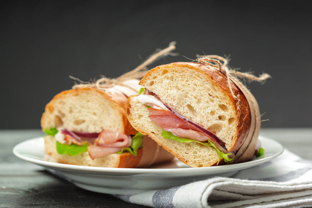 fresh italian sandwich on wooden table - 写真・画像