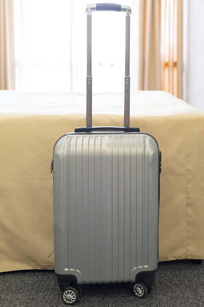 Suitcase or luggage bag in a modern hotel room - Foto, afbeelding