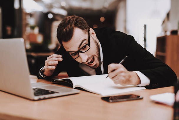 Damp Squib. Ideas. Business Suit. Project. Laptop. Sit. Brainstorm. Young Guy. Businessman. Work. Office. Creative Worker. Businesspeople. Workplace. Inspiration. Comfortable Office. Eyeglasses. - Fotoğraf, Görsel