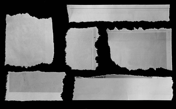 Έξι κομμάτια σκισμένο χαρτί σε μαύρο - Φωτογραφία, εικόνα