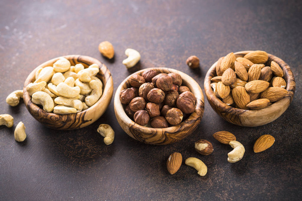 Nuts assortment in a bowls. - Fotoğraf, Görsel