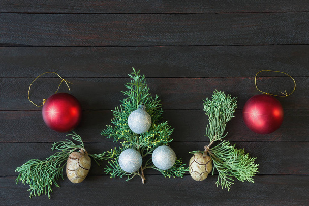 Christmas decorations on dark background. Flat lay, free space for text - Photo, Image