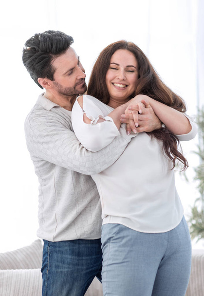 happy husband hugging pregnant wife - Photo, Image