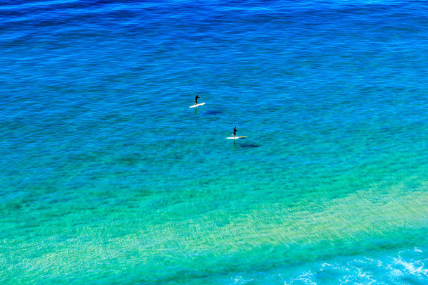 Paddleboarders on the sea at Burleigh, Gold Coast, Queensland, Australia, - Photo, Image