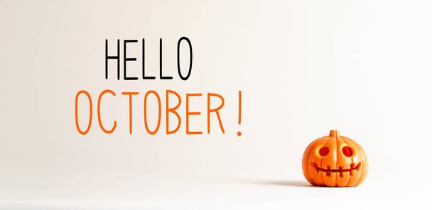 Hello October with a small pumpkin - Foto, afbeelding