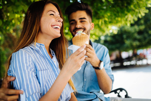 Happy young couple having date and eating ice cream - Fotografie, Obrázek
