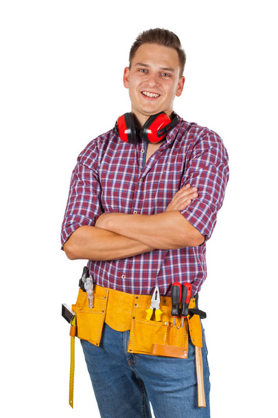 Portrait of handsome repairman holding tools,smiling to the camera on isolated - Valokuva, kuva