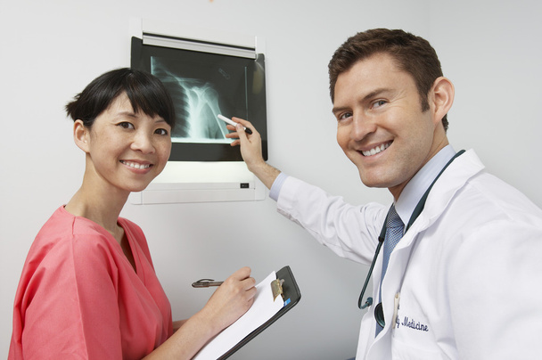 Friendly Medical Staff Members With X-Ray Results - Photo, Image